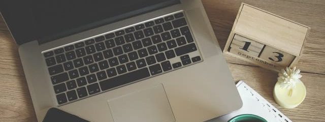 Working on laptop to increase elearning productivity