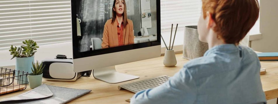 photo of child sitting by the table while looking at the 4145153 1